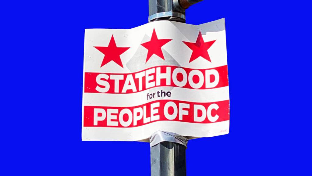 A street sign that says "STATEHOOD for the PEOPLE OF DC"