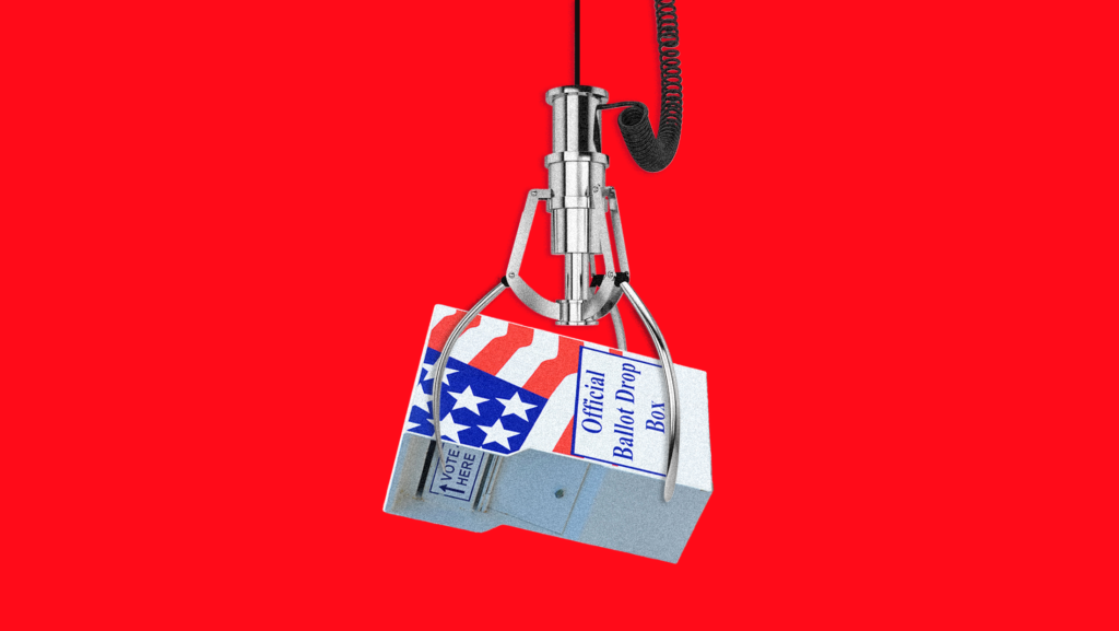 A claw crane lifting a ballot drop box