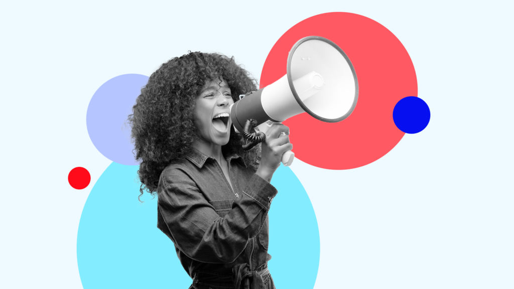 A female candidate for office speaking into a megaphone