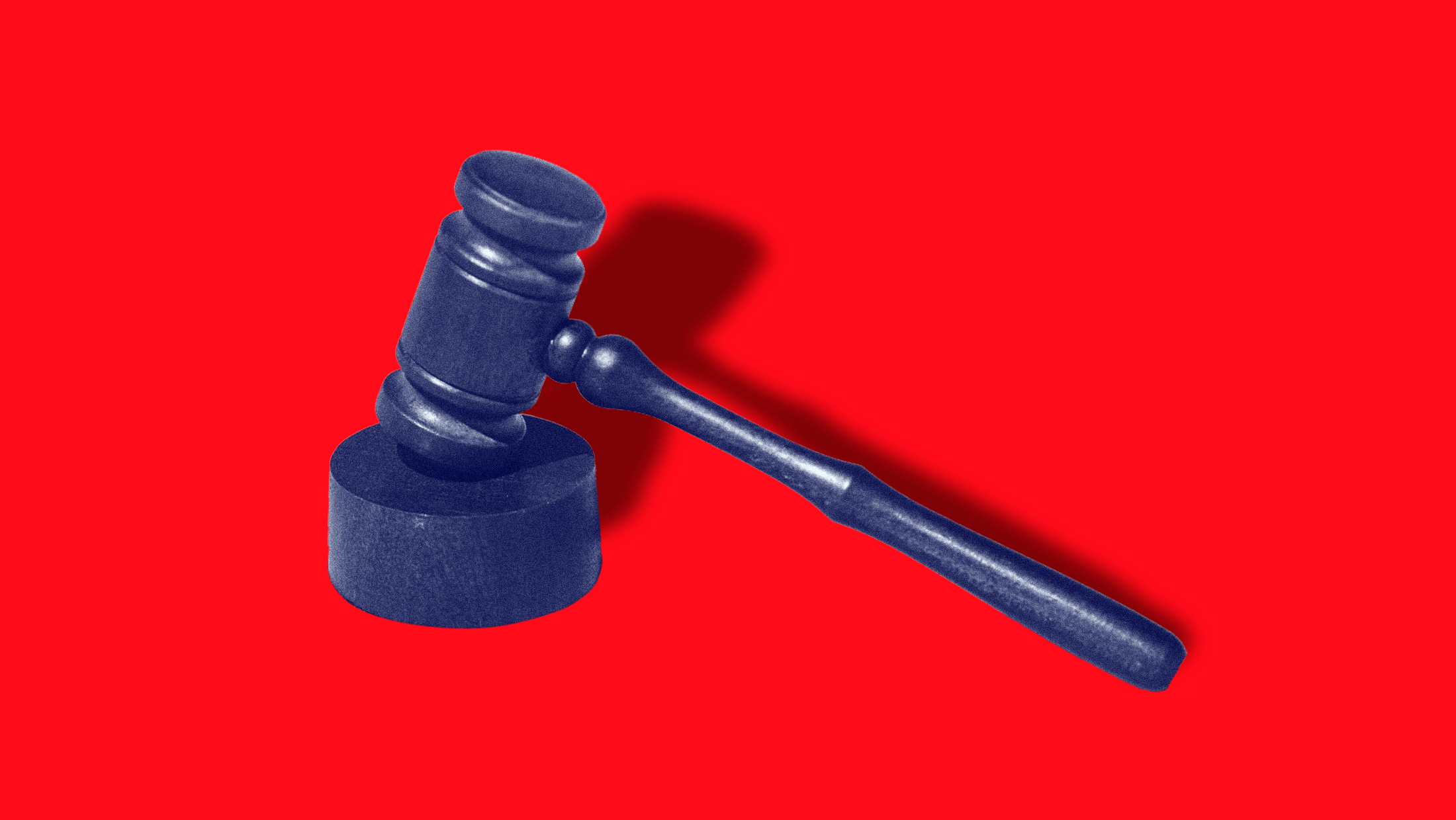 Bright red background showing a gavel with a shadow behind it