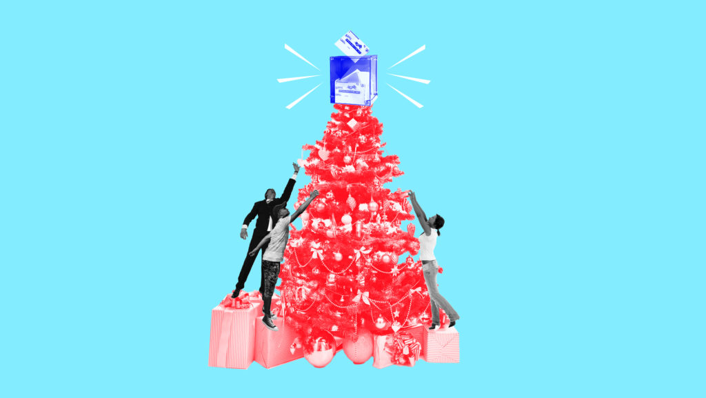 Light blue background with red-toned Christmas tree and black and white toned people putting up ornaments on the tree and a blue-toned ballot box with ballots inside it on top of the tree.