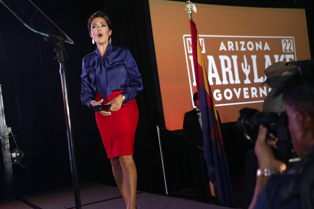Kari Lake, Republican candidate for Arizona governor, reacts to cheers from her supporters as she pauses while speaking Tuesday, Aug. 2, 2022, in Scottsdale, Ariz. (AP Photo/Ross D. Franklin)