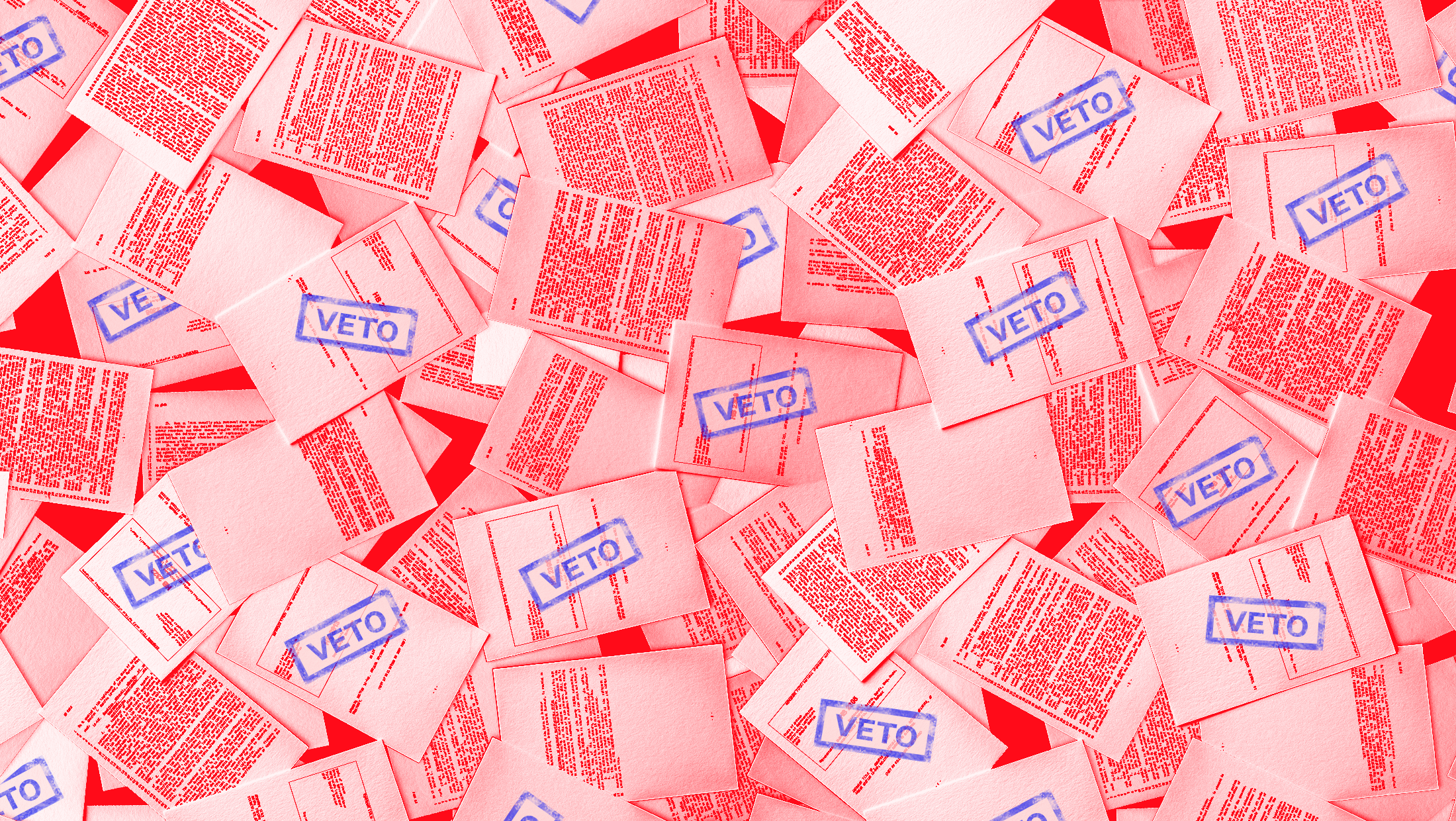 A pile of red-tinted bills with occasional blue VETO stamps.