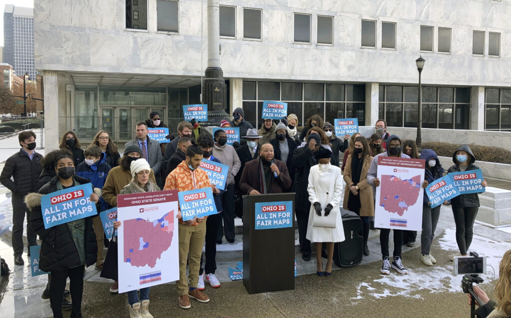 Advocates who believe that newly drawn Ohio legislative maps remain heavily gerrymandered rally outside the Ohio Supreme Court on Wednesday, Dec. 8, 2021, in Columbus, Ohio. Campaigns for Congress already are underway for this year's elections, but lingering disagreements over the final shape of new voting districts has left some candidates, and would-be candidates, in limbo. A few states have yet to enact new congressional districts following the 2020 census and some had their maps struck down by courts. (AP Photo/Andrew Welsh-Huggins, File)