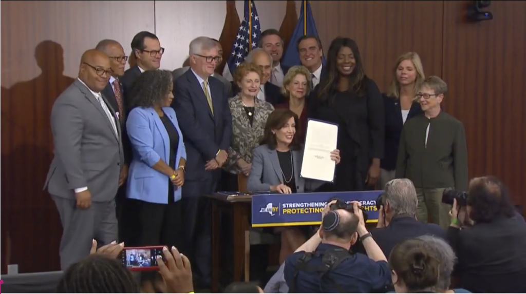 Hochul signs voting rights bill package at a press conference on Sept. 20, 2023.