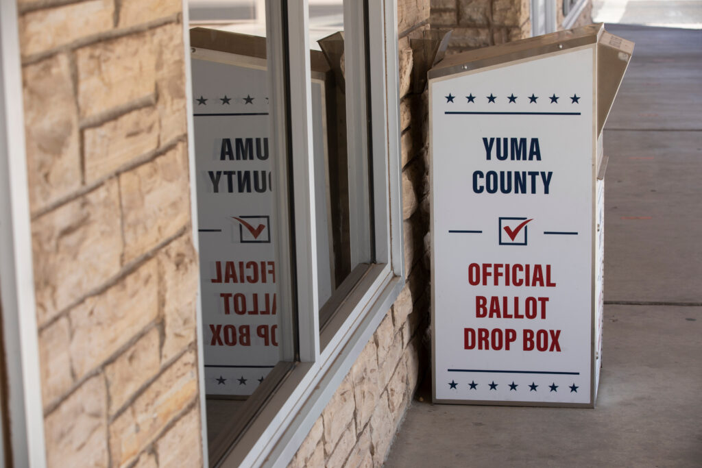 Image of a ballot drop box. On the drop box are the words "Yuma county official ballot drop box" (Adobe Stock)