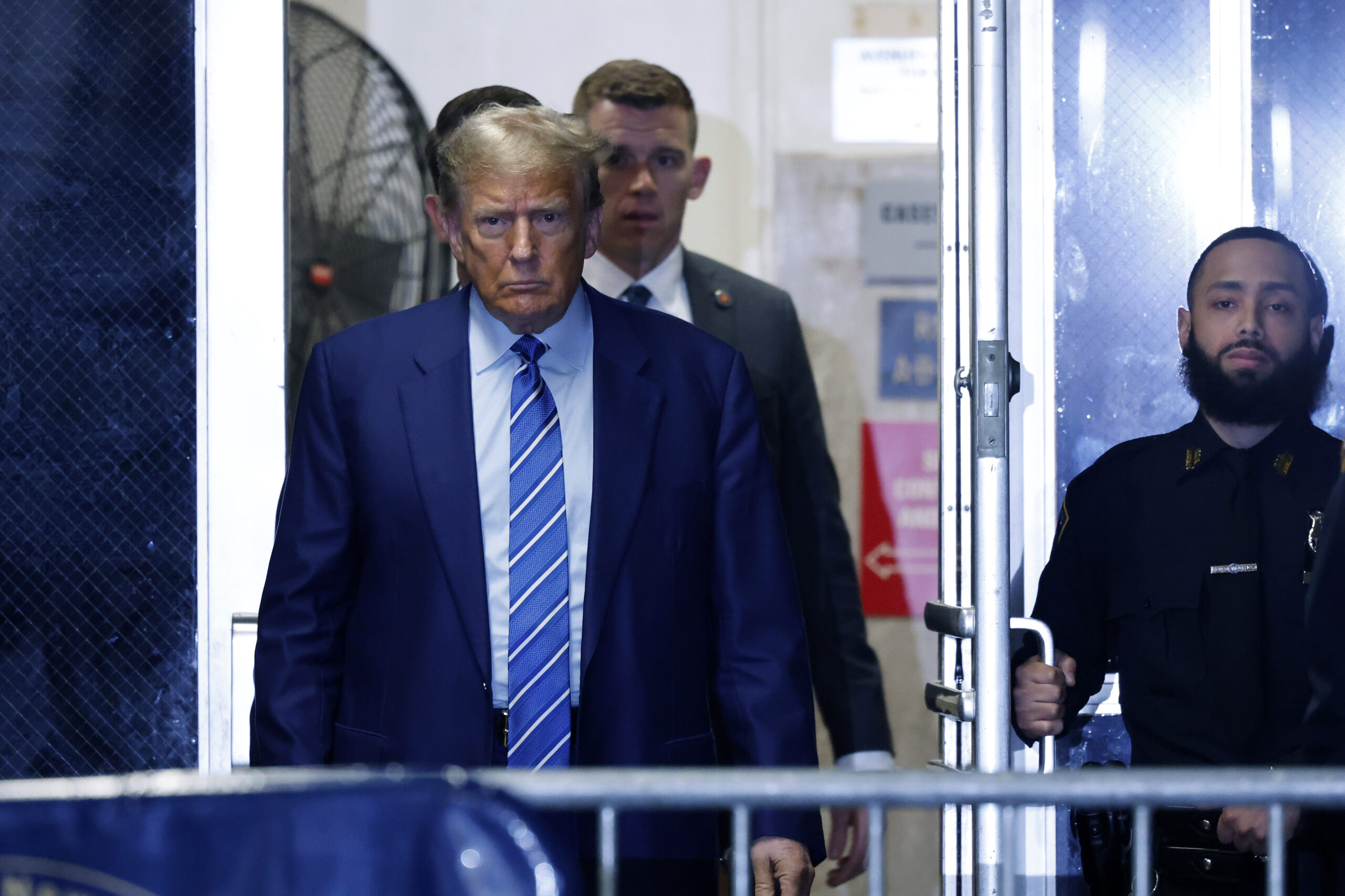 Former President Donald Trump returns to the courtroom after a break during the second day of jury selection at Manhattan criminal court, Tuesday, April 16, 2024, in New York. Donald Trump returned to the courtroom Tuesday as a judge works to find a panel of jurors who will decide whether the former president is guilty of criminal charges alleging he falsified business records to cover up a sex scandal during the 2016 campaign. (Michael M. Santiago/Pool Photo via AP)