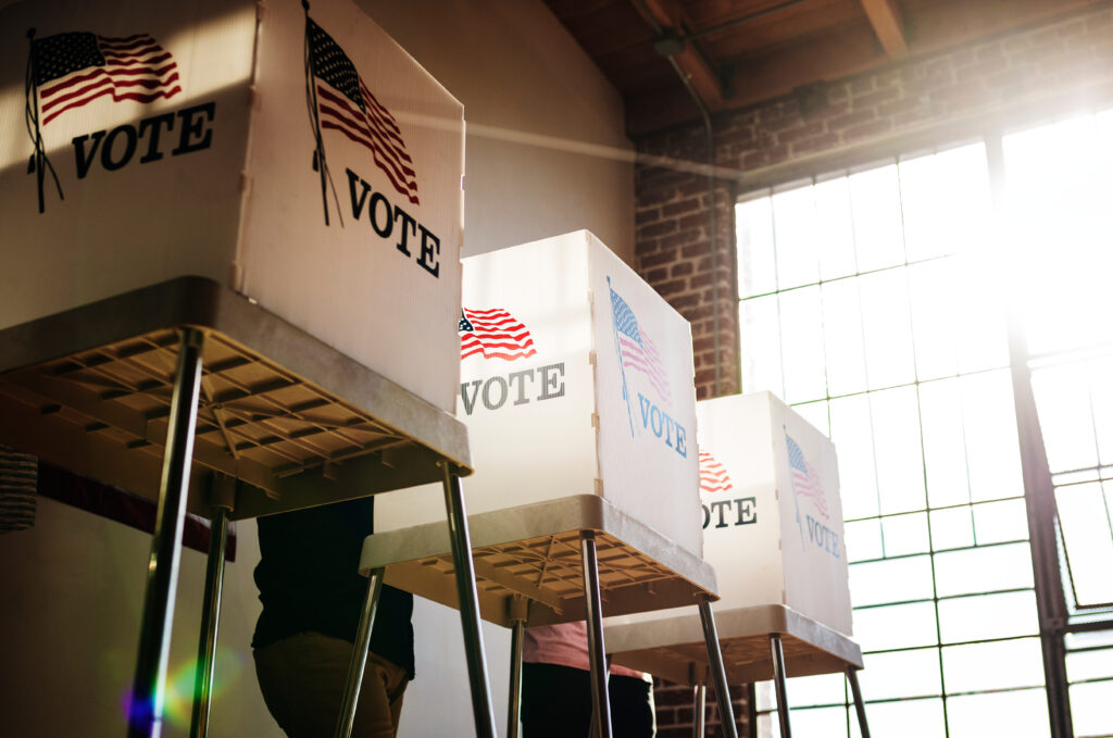 People voting election poll (Adobe Stock)