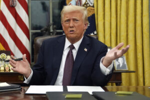 President Donald Trump talks to reporters as he signs executive orders in the Oval Office of the White House, Monday, Jan. 20, 2025, in Washington. (Evan Vucci/AP)