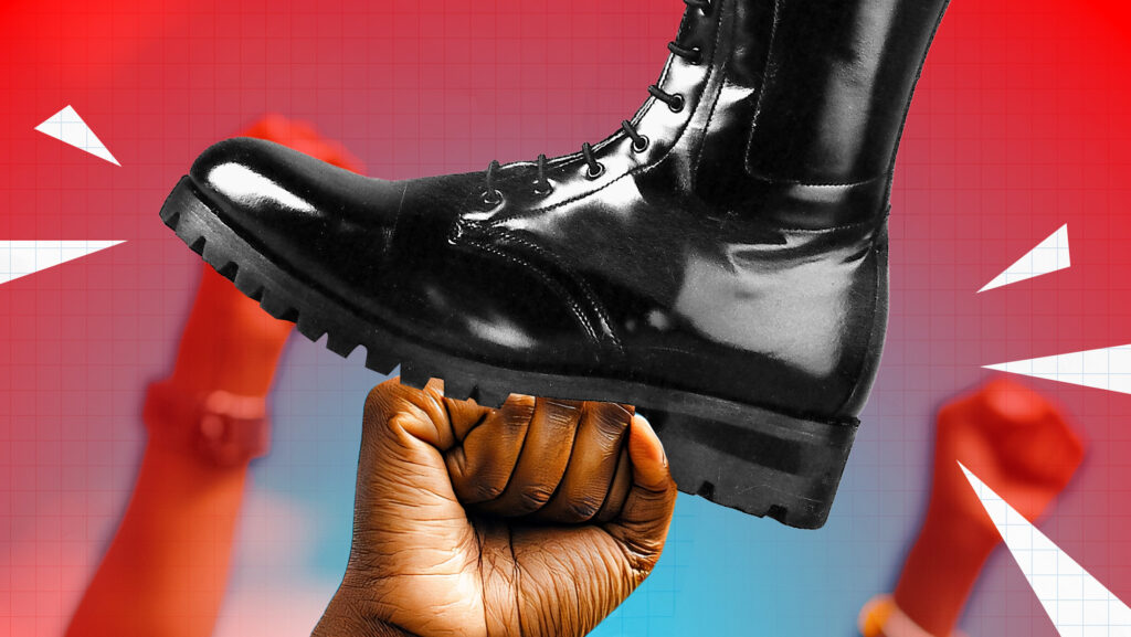 Red background with fists punching up and a big black boot stomping on them.
