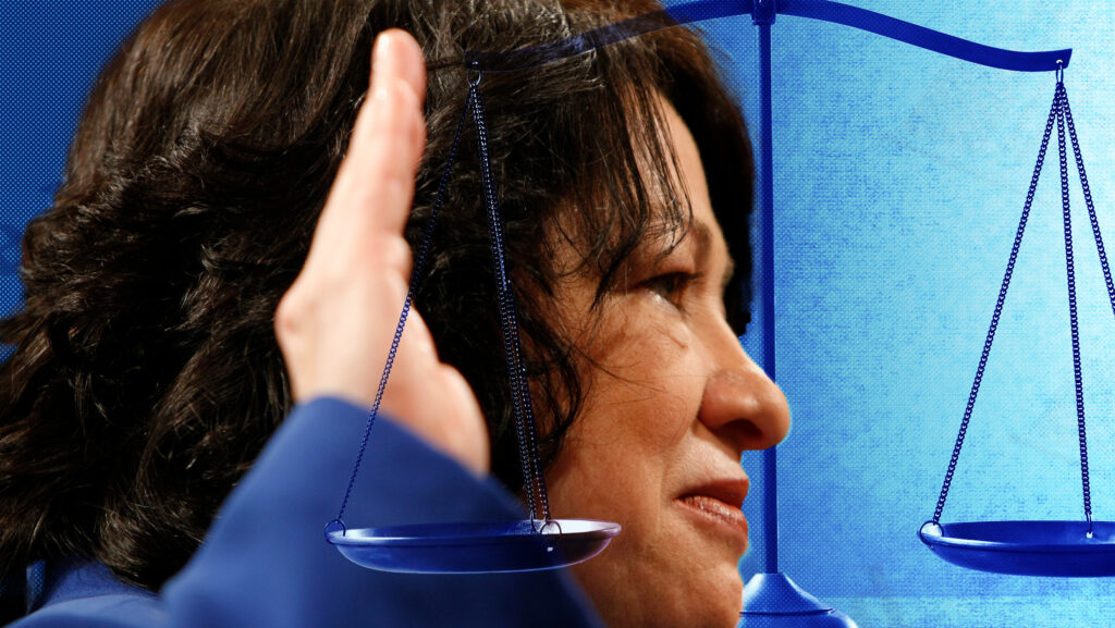 Justice Sotomayor raising her right hand with a blue background