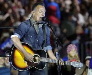 Bruce Springsteen performs during a Hillary Clinton campaign event at Independence Mall on Monday, Nov. 7, 2016 in Philadelphia. (AP Photo/Matt Slocum)