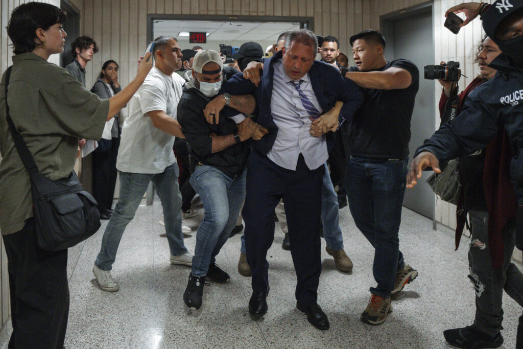 Federal agents arresting New York City Comptroller Brad Lander outside a federal immigration court. (AP Photo/Olga Fedorova)