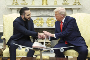 President Trump shaking hands with El Salvador's President Nayib Bukele during an oval office meeting.
