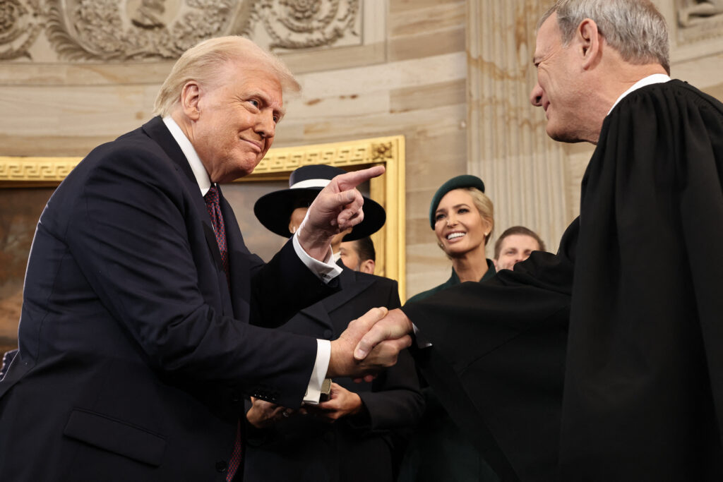 President Donald Trump shaking hands with Supreme Court Chief Justice John Roberts in January 2025.