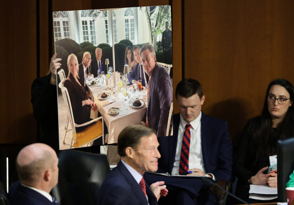 U.S. Sen. Richard Blumenthal (D-CT) points to a photo of U.S. Attorney General Pam Bondi at a dinner with U.S. President Donald Trump while questioning Bondi as she testifies before the Senate Judiciary Committee on October 07, 2025. Bondi faced criticism from Democrats on the Justice Department’s targeting of Trump’s political opponents, including the recent indictment of former FBI Director James Comey. (Photo by Alex Wong/Getty Images)