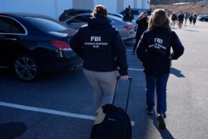 FBI officers at the Fulton County Election Hub and Operation Center on Jan. 28, 2026, in Union City, Georgia, outside Atlanta.