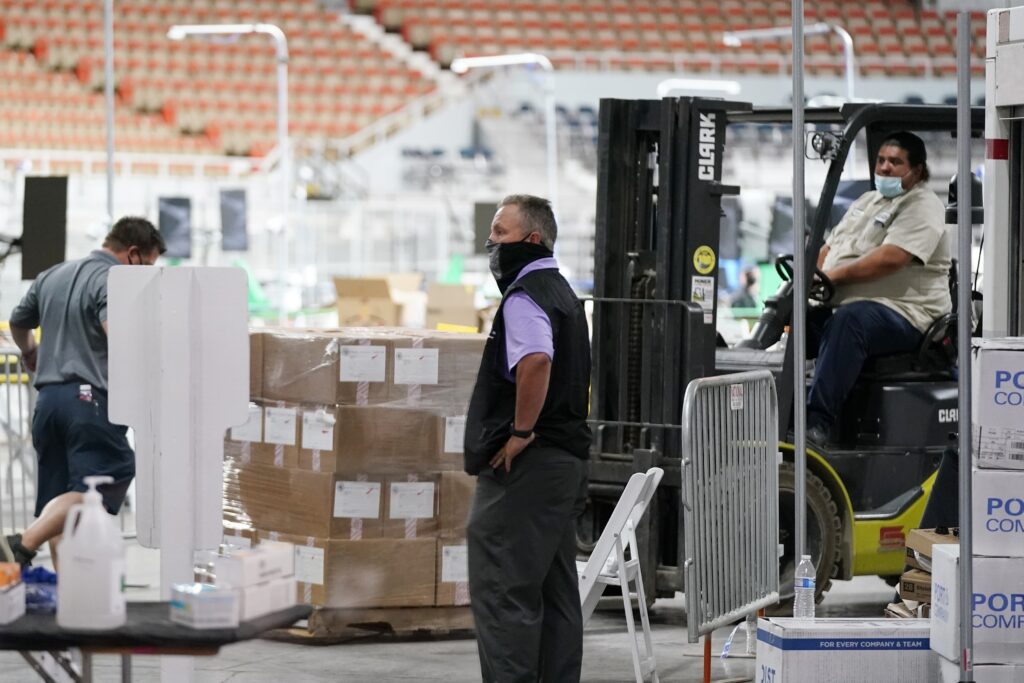 Some of the 2.1 million ballots cast during the 2020 election are brought in for recounting at an election ballot audit ordered by the Republican lead Arizona Senate at the Arizona Veterans Memorial Coliseum, during a news conference, April 22, 2021, in Phoenix.