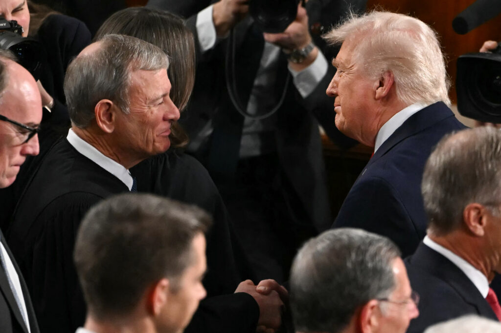President Trump shaking hands with Supreme Court Chief Justice John Roberts before the State of the Union address in Congress in February 2026.