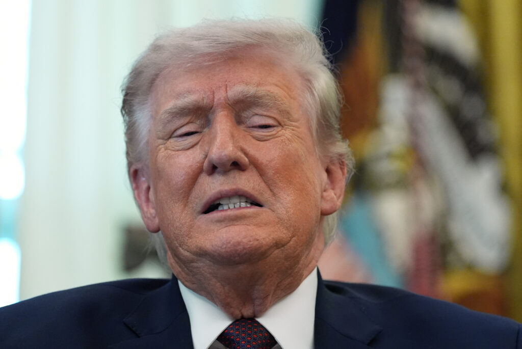 President Donald Trump answers questions from reporters after signing an executive order on 'Ensuring Citizenship Verification and Integrity in Federal Elections' in the Oval Office of the White House Tuesday, March 31, 2026, in Washington. (AP Photo/Alex Brandon)