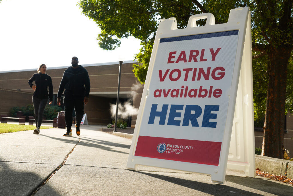 Signs directing people where to go to cast their votes on the first day of early voting at site in Atlanta in October 2024. (Photo: Megan Varner/Getty Images)