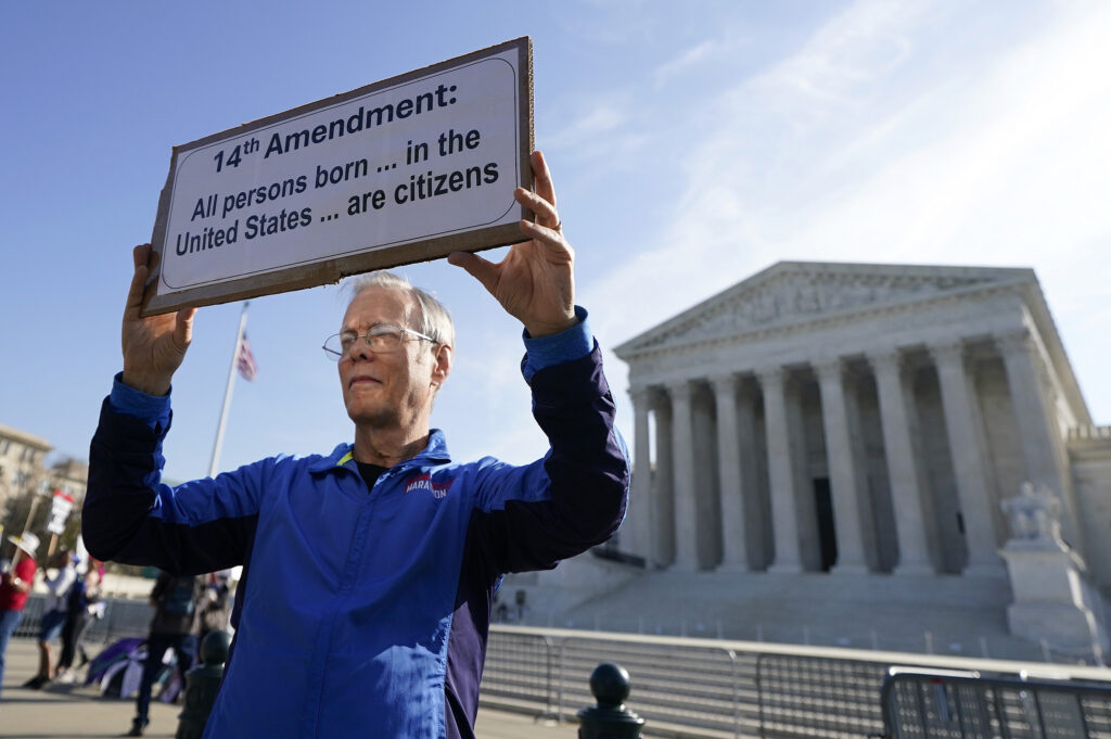 A person holding a sign outside the U.S. Supreme Court in April 2026 in Washington, D.C. (Photo: Al Drago/Getty Images)