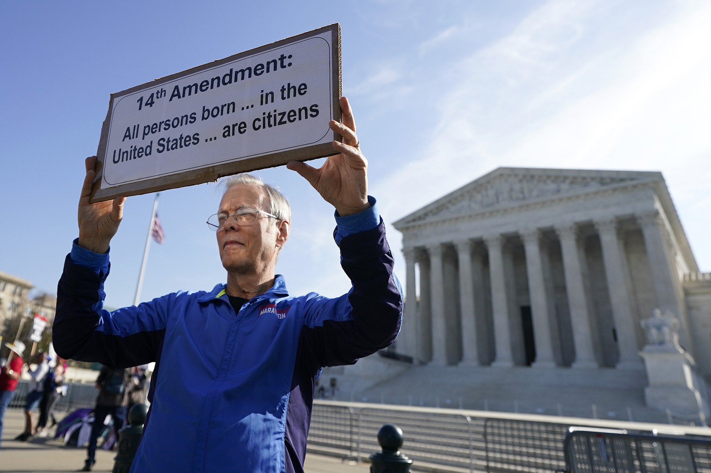 A person holding a sign outside the U.S. Supreme Court in April 2026 in Washington, D.C. (Photo: Al Drago/Getty Images)