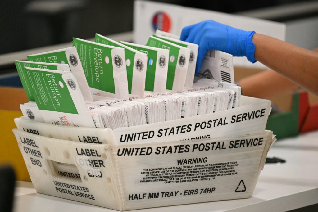 An election worker processes mail ballots in Los Angeles County June 2, 2026. (Photo: Patrick T. Fallon/AFP via Getty Images)