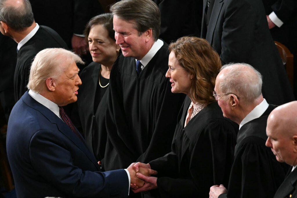 President Trump shakes hands with Supreme Court Justice Amy Coney Barrett in the U.S. Capitol in Washington, D.C., in March 2025. (Photo: Saul Loeb/AFP via Getty Images)
