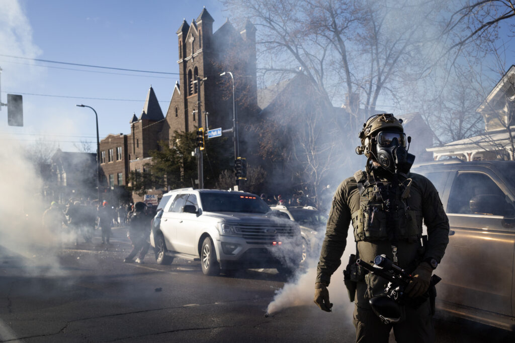 A masked federal immigration agent outside a church in Minneapolis, Minnesota. (Photo: Scott Olson/Getty Images)