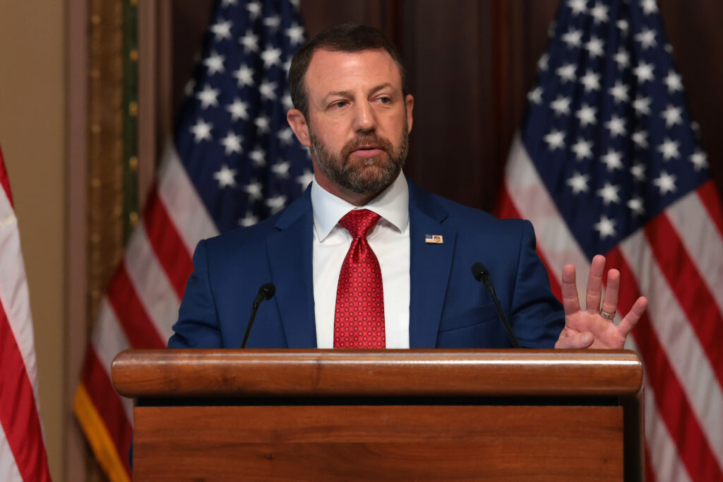 Homeland Security Secretary Markwayne Mullin speaking in the Eisenhower Executive Office Building in July 2026 in Washington, D.C. (Photo: Anna Moneymaker/Getty Images)