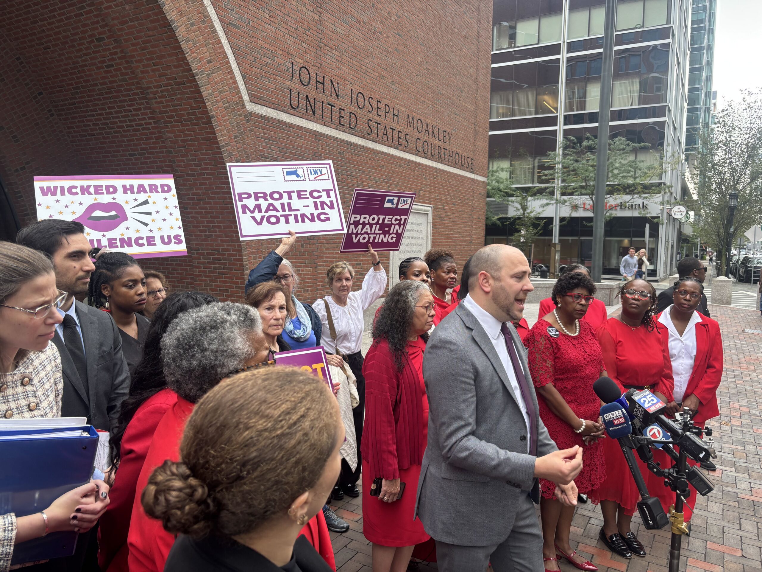 Davin Rosborough, an ACLU attorney representing the League of Women Voters of Massachusetts, speaks at a press conference outside the John Moakley Courthouse in Boston, Mass. after participating in a hearing Sept. 3 on President Donald Trump's March 31, 2026 executive order and a Postal Service rule implementing it.