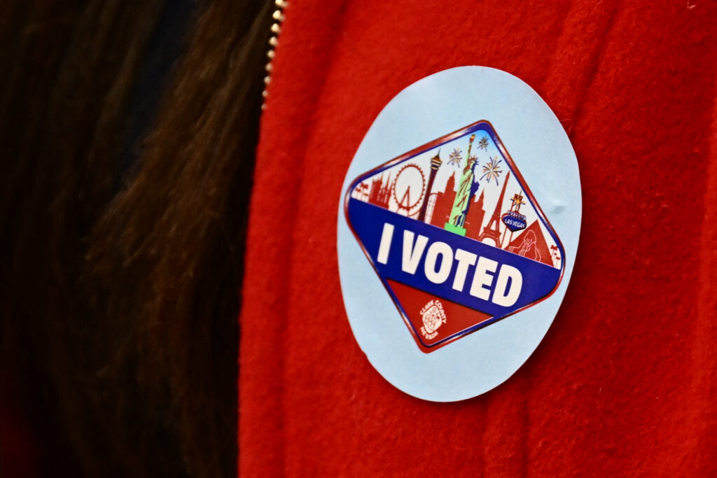 A voter wears an I Voted sticker with the Las Vegas skyline in Las Vegas, Nevada, on February 6, 2024. (Photo by Patrick T. Fallon / AFP)