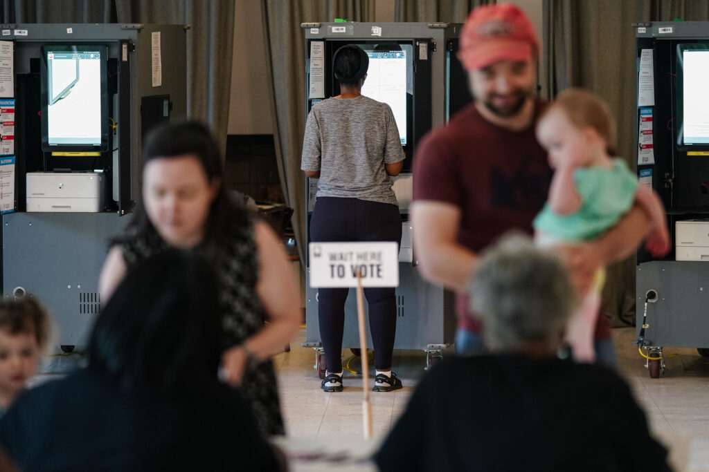 Voting casting ballots and checking in at a polling location in May 2024 in Atlanta. (Photo: Elijah Nouvelage/Getty Images)