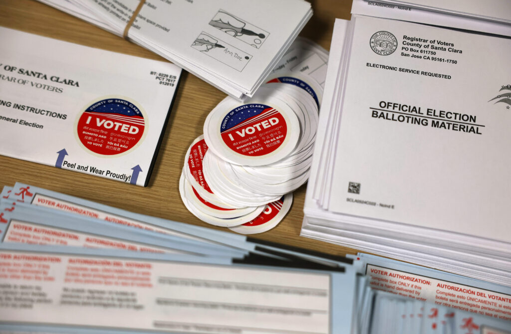 Election materials are displayed on a table at the Santa Clara County registrar of voters office on October 21, 2024 in San Jose, Calif. (Photo by Justin Sullivan/Getty Images)