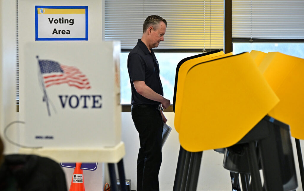 A man casts his ballot at the Los Angeles County Registrar on Oct. 28, 2024, in Norwalk, Calif. (Photo by Frederic J. Brown/AFP via Getty Images