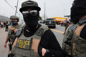 An Immigration and Customs Enforcement agent in front of protesters in May 2026 in Newark, New Jersey. (Photo: Michael M. Santiago/Getty Images)