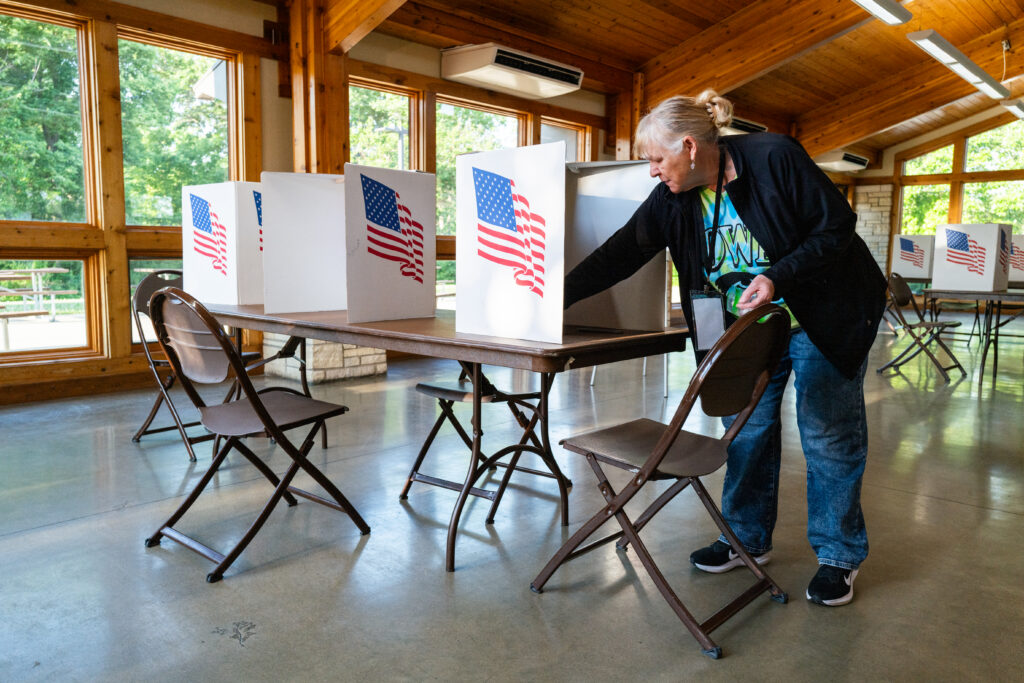 MARION, IOWA - JUNE 2: A poll worker places "I Voted" stickers inside of ballot boxes. June 2, 2026, Marion, Iowa. (Photo by Stephen Maturen/Getty Images)