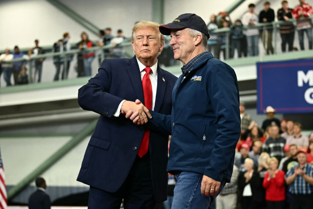 President Donald Trump with U.S. Senator Dan S. Sullivan (R-Alaska) in Wasilla, Alaska, on Oct. 13. (Photo: Kent Nishimura/AFP via Getty Images)