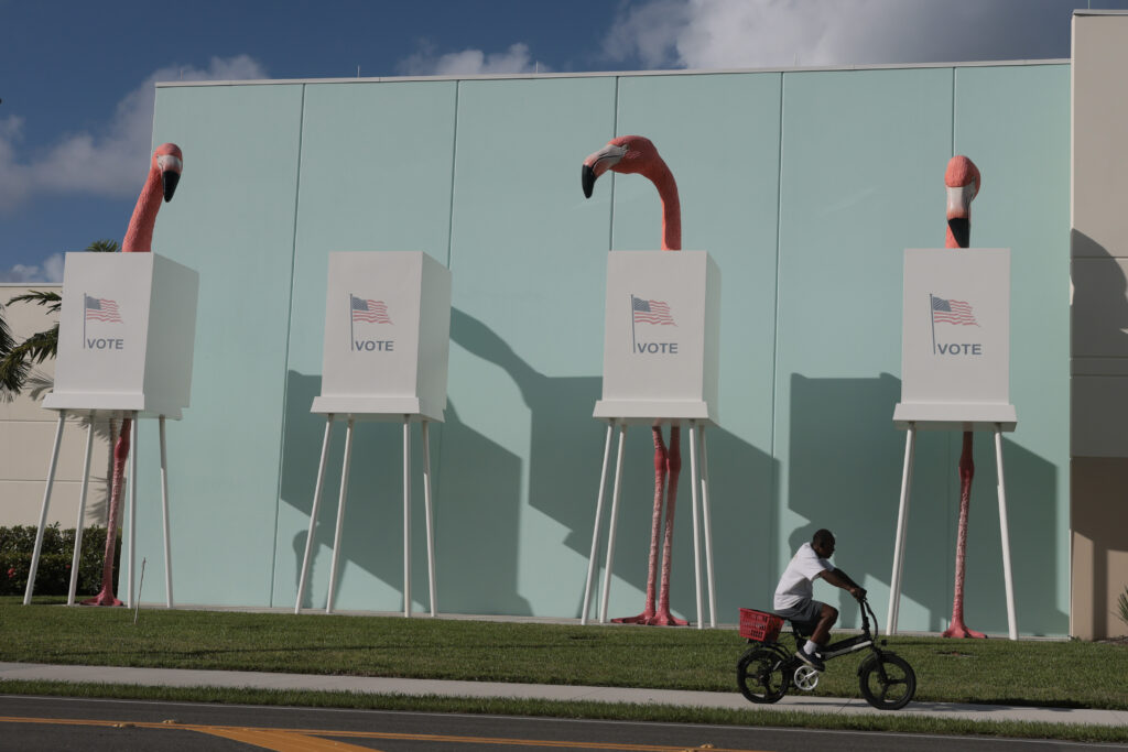 A person on a bike rides past a voting sculpture on Oct. 19 in Palm Beach, Florida. (Photo: Joe Raedle/Getty Images)